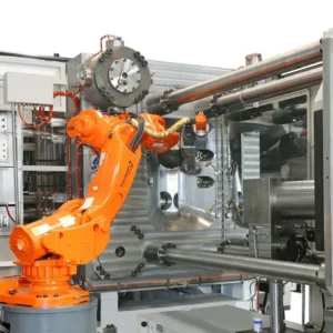 Industrial robot extracting freshly cast aluminum part from opened high-pressure die casting mold